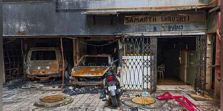 Charred vehicles after a fire broke out in a multi-storey residential building in Goregaon area Mumbai